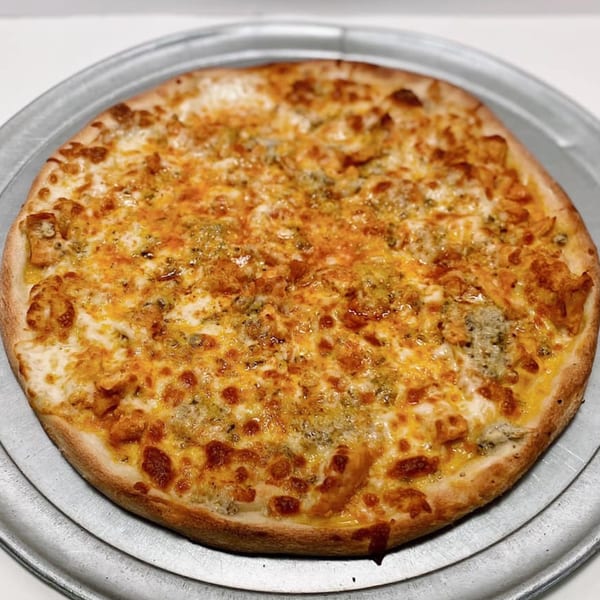 A ZIPS' NY Pizza & Italian Kitchen pizza with melted cheese and toppings on a metal tray.